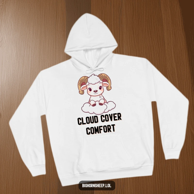 Funny hoodie featuring an endearing bighorn sheep subtly peeking out from behind a colossal, fluffy cloud, exuding innocence and humor.