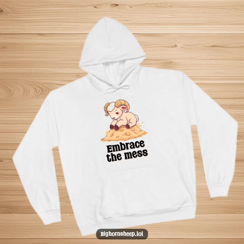 Funny bighorn sheep cub hoodie, happily rolling in dust, showcasing a hilarious and cozy design for ultimate comfort and laughs.