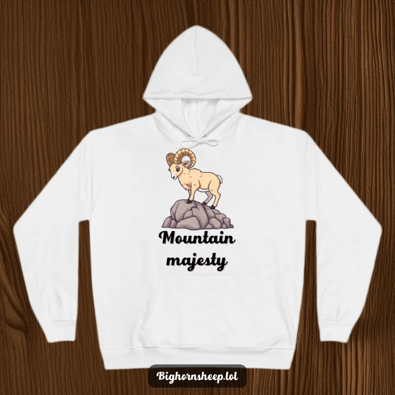 Majestic bighorn sheep posing dramatically on a rocky ledge, featured on a warm and cozy hoodie.