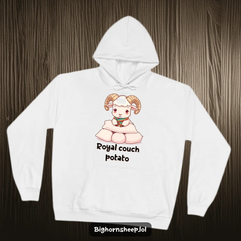 Funny Hoodie: Regal bighorn sheep wearing a sash, playfully buttering a stack of soft pillows.