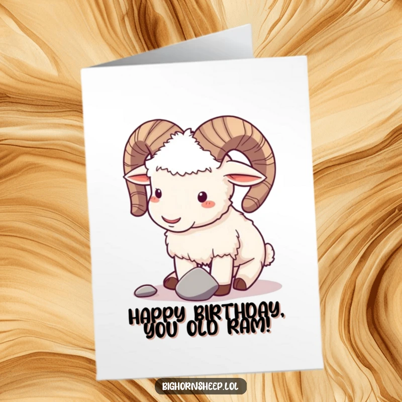 Funny Free Printable Birthday Card: Playful bighorn sheep gently butting horns with a pebble.