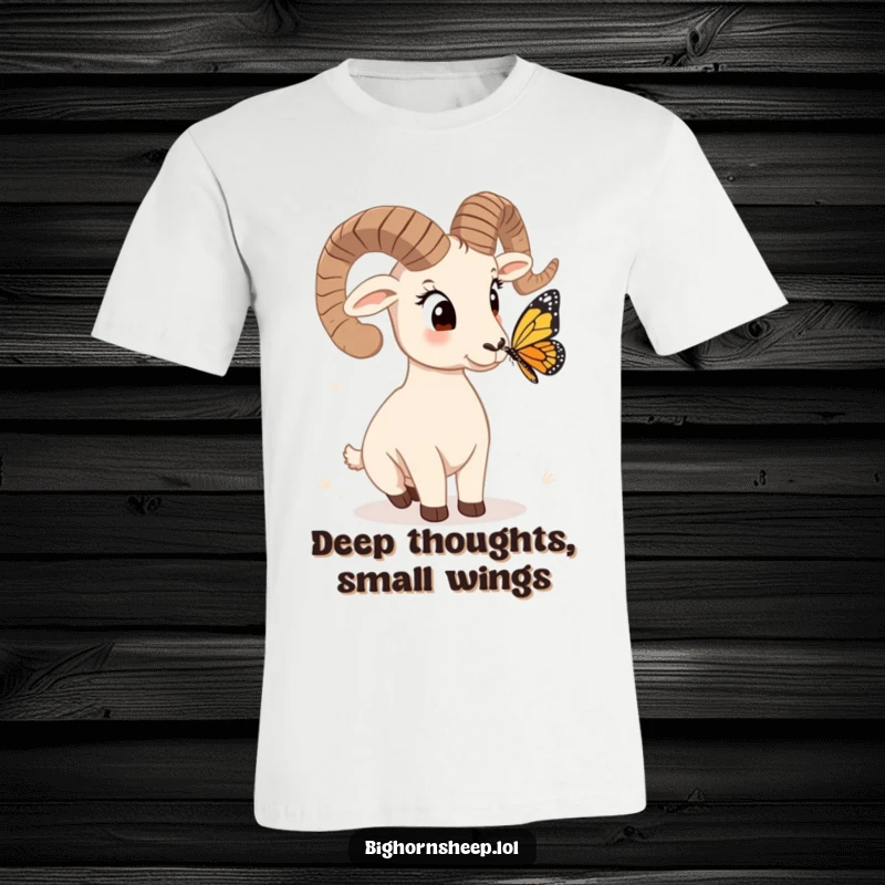 Funny bighorn sheep t-shirt, head tilted quizzically at a butterfly, depicting a hilarious moment of innocent wonder.